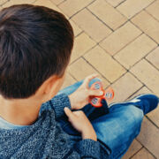 Boy using fidget spinner