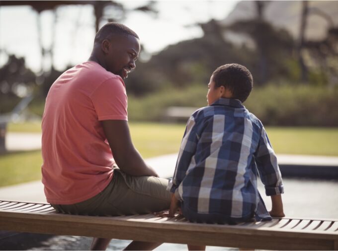 Adult in conversation with a young person.